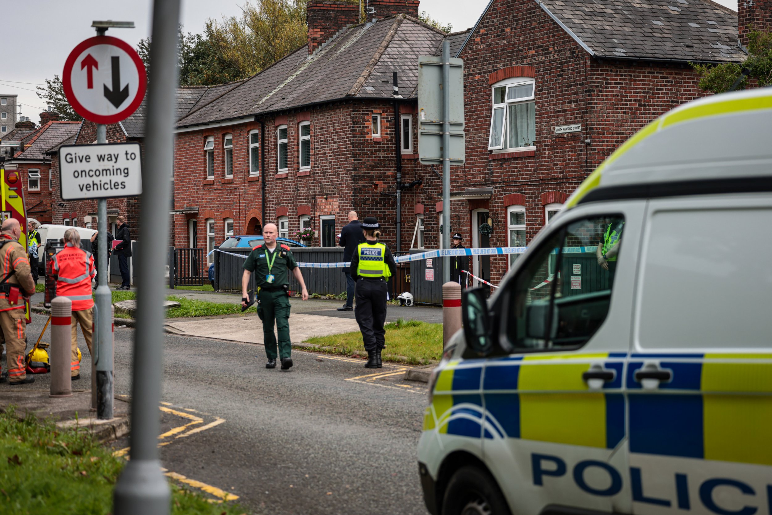 A cordon is in place on a street in Salford this afternoon (Sept 23) amid an ongoing police incident. Officers are at the scene on South Radford Street, Kersal, with a cordon in place near the junction with Kingsley Avenue. Caption: Police on South Bradford Street, Kersal, Salford, during an incident on 23 September 2024