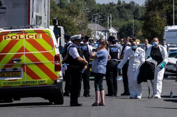 Police work at the scene in Southport, England, where a man has been detained and a knife has been seized after a number of people were injured in a reported stabbing.
