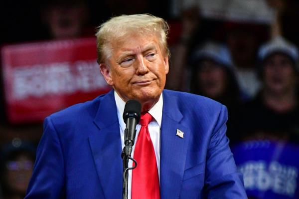 Former US President and Republican presidential candidate Donald Trump looks on during a campaign rally at Findlay Toyota Arena in Prescott Valley, Arizona, on October 13, 2024. (Photo by Caitlin O'Hara / AFP)