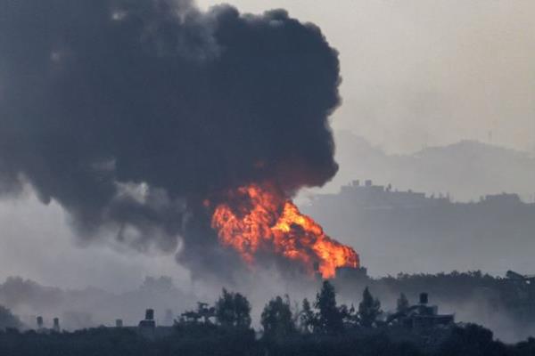 A fireball erupts in the Gaza Strip during Israeli bombardment