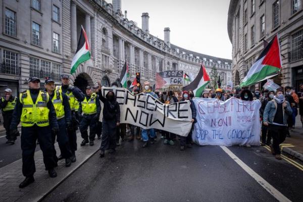 Officers from the Metropolitan police keeping a close watch on the peaceful protestors who are calling for an immediate ceasefire in Gaza