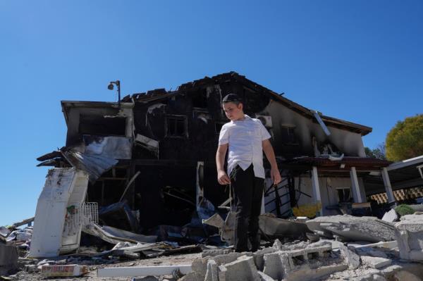 Children inspecting a house in Safed, Israel damaged by a rocket attack from Lebanon on Sept. 28, 2024.