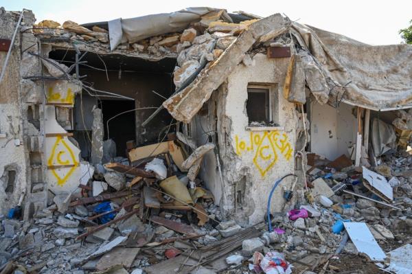 A view of a house left in ruins after an attack by Hamas militants on this kibbutz days earlier when dozens of civilians were killed near the border with Gaza, on October 10, 2023 in Kfar Aza