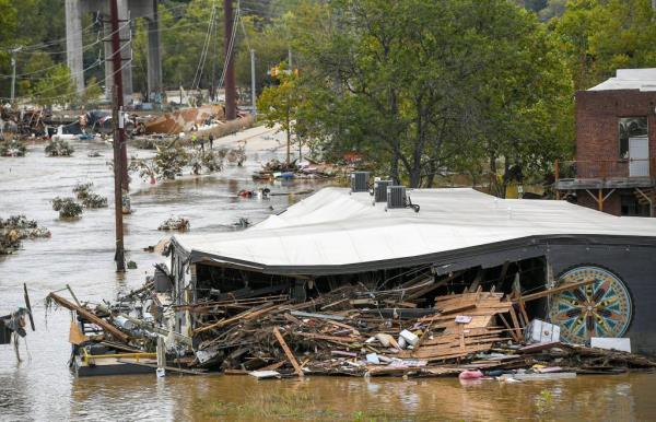 Receding floodwater in the River Arts District in downtown Asheville, N.C., following the destruction caused by Hurricane Helene in 2024