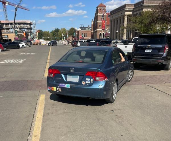 Both vehicles had minor damage, police said, and the woman received a traffic summons for unsafe backing.