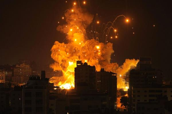 A missile explodes in Gaza City during an Israeli air strike on Oct. 8, 2023.