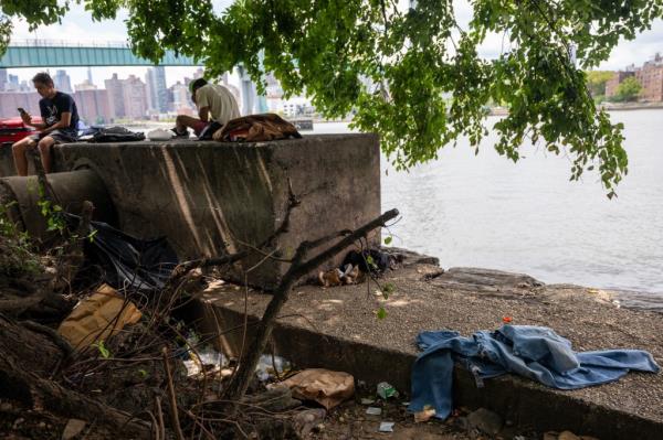 Migrants from Randall's Island encampment.