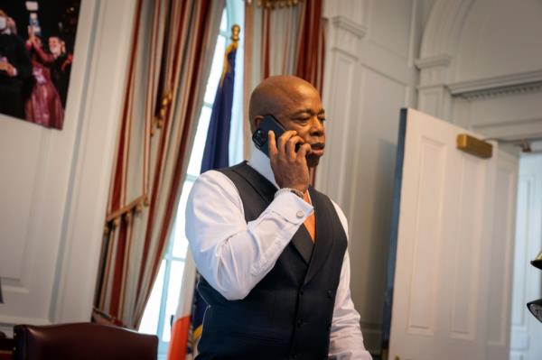 Adams in his office talking on a phone