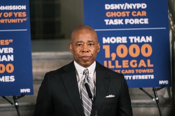 New York City mayor Eric Adams standing in front of a microphone during a press conference in the City Hall rotunda, after his indictment on bribery charges