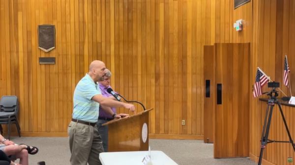"You're treating them like lawful U.S. citizens, which they are not," Phillips said during the city council meeting before being cut off.