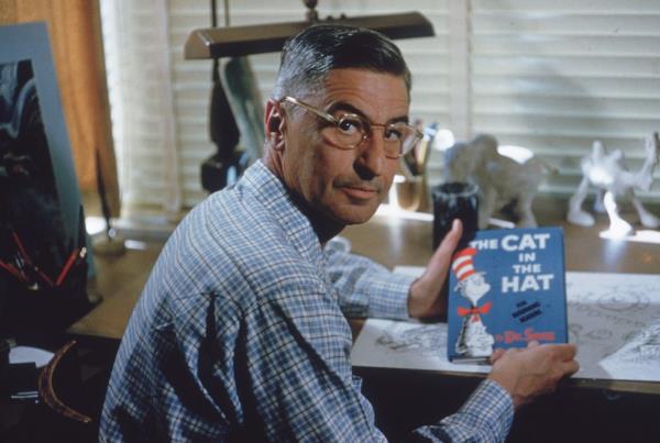 Dr. Seuss holding "The Cat in the Hat"