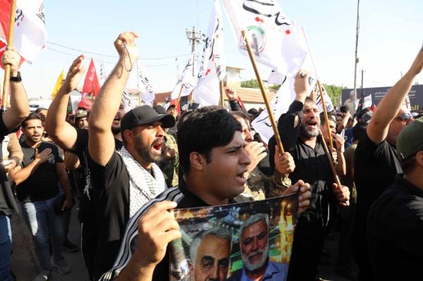 People attend a funeral for four Iraqi paramilitary Hashd Shaabi fighters in Baghdad, Iraq, on July 31, 2024