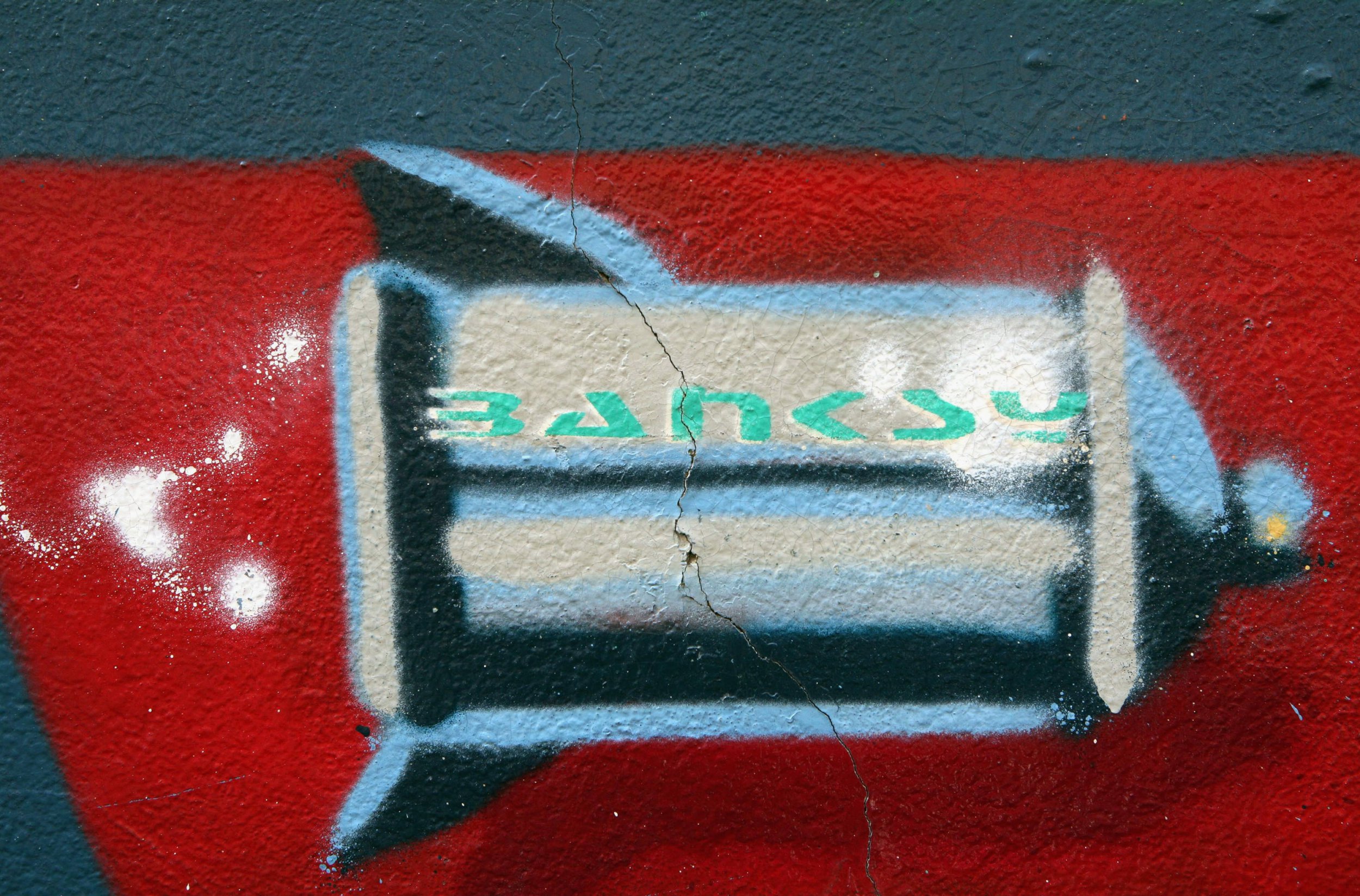 BRISTOL, UNITED KINGDOM - FEBRUARY 8: A mural said to be by the artist Banksy adorns the side of a house in Easton, February 8, 2007, in Bristol, England. The owners of the five-bedroom house - which was spray-painted by the graffiti artist Banksy three years ago - have resisted attempts to obliterate the 25ft by 6ft mural and are said to be considering putting it up for sale through an art gallery - with the attached house thrown in for free. (Photo by Matt Cardy/Getty Images)