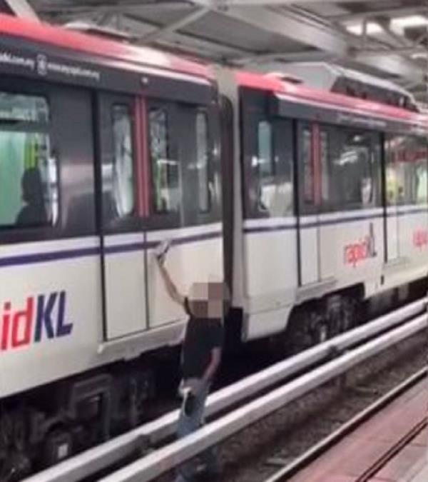 Police tracking down man who trespassed on LRT track, attempted to molest woman