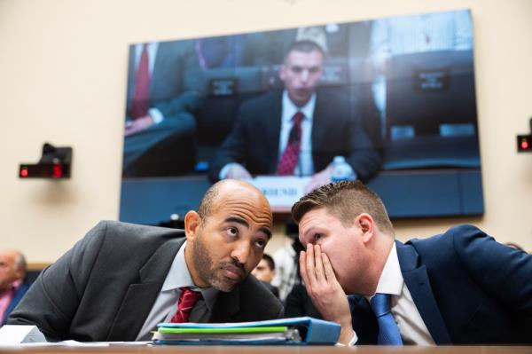 FBI whistleblower Marcus Allen, left, and Tristan Leavitt, president, Empower Oversight, confer during the House Judiciary Select Subcommittee on the Weaponization of the Federal Government to "examine abuses seen at the Bureau and how the FBI has retaliated against whistleblowers,"