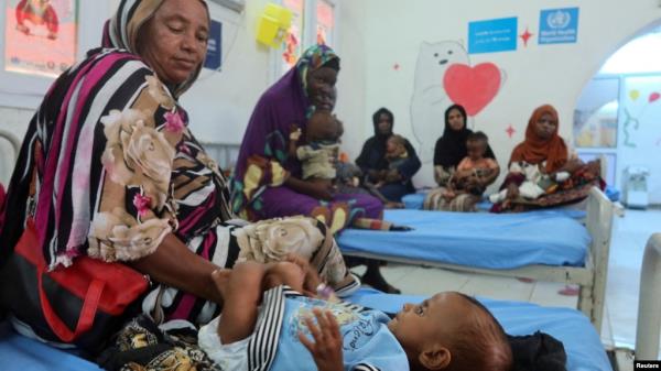 FILE - Children suffering from malnutrition, are treated at Port Sudan Paediatric Center, during a visit by WHO Director-General Tedros Adhanom Ghebreyesus to the country, in Sudan, Sept. 7, 2024. 