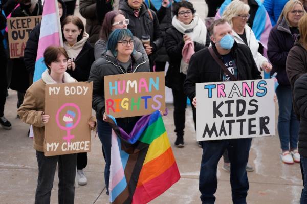 People gather in support of transgender youth during a rally at the Utah State Capitol.