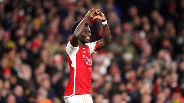 Trossard and Saka strike to put Arsenal on brink of Champions League knockouts