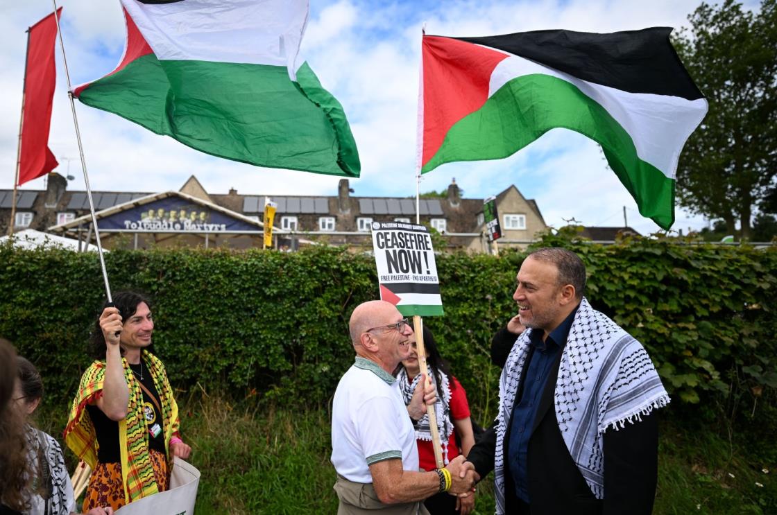 Husam Zomlot (R) Palestinian ambassador to the U.K., takes part in a pro-Palestinian march in Tolpuddle, U.K., July 21, 2024. (Getty Images Photo)