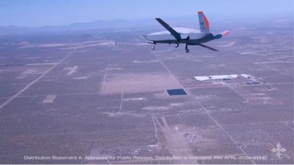 US Air Force's XQ-67A drone flying over a desert, representing a shift in military thinking