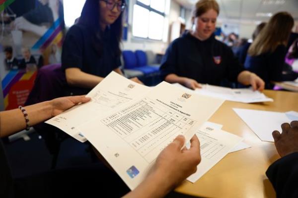 EDINBURGH, SCOTLAND - AUGUST 08: Pupils at Craigmount High receive the results of the Scottish Qualifications Authority exam result on August 8, 2023 in Edinburgh, Scotland. Students across Scotland are finding out their exam results this morning either by post or text message. (Photo by Jeff J Mitchell/Getty Images)