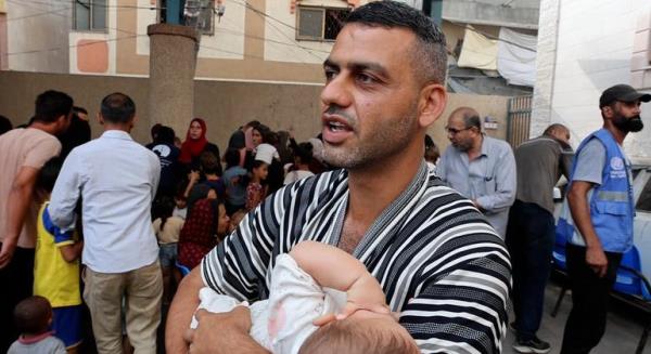 Mohamed Rajab, took his daughter to UNRWA's Deir El Bala health center to get polio vaccination. Mohamed Rajab, took his daughter to UNRWA's Deir El Bala health center to get polio vaccination.