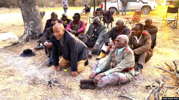 Elders light a fire at a border post in eastern Namibia.