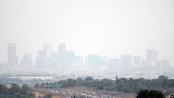 Haze hangs in the air over downtown Denver, July 24, 2024. Fires burning in western states, as well as Canada, have filled the skies with smoke and haze, forcing some affected areas to declare air quality alerts or advisories. 