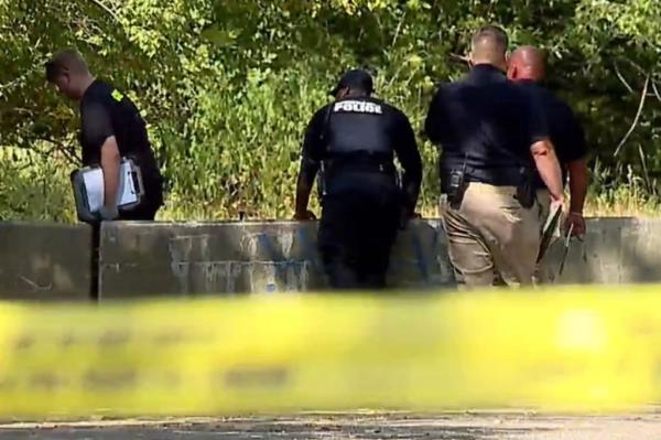 police search the wooded area where Dixon was found