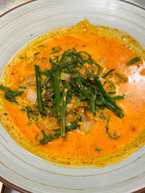 Flood your rice with the Gulai Paku, where fern fronds are paired with creamy, mildly spicy curry — Picture by Lee Khang Yi