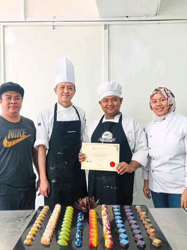 With the right training, members of the deaf community like Hafiz (second from right) can thrive and build successful careers.