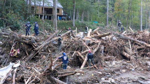 Members of the Indiana Task Force 1 Search and Rescue team searching for a missing woman along Buck Creek, North Carolina