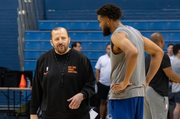 Karl-Anthony Towns, right, speaks with NY Knicks head coach Tom Thibodeau during practice at the Citadel McAlister Field House