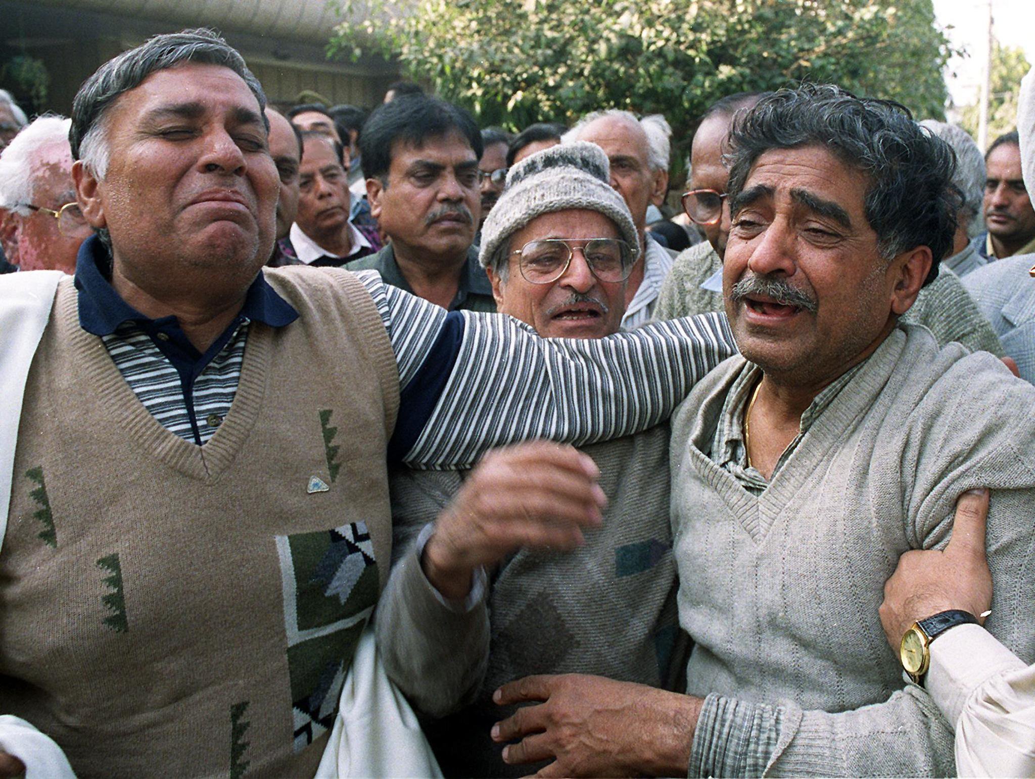 Chandra Prakash Katyal (R), the father of Ripin Katyal who was killed by hijackers of Indian Airlines flight IC 814.