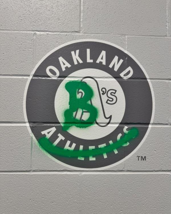 Billie Joe Armstrong vandalizes the Oakland A's logo