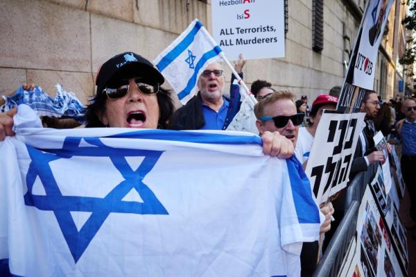 People gather during a rally on the Israel-Hamas conflict outside the Columbia University 