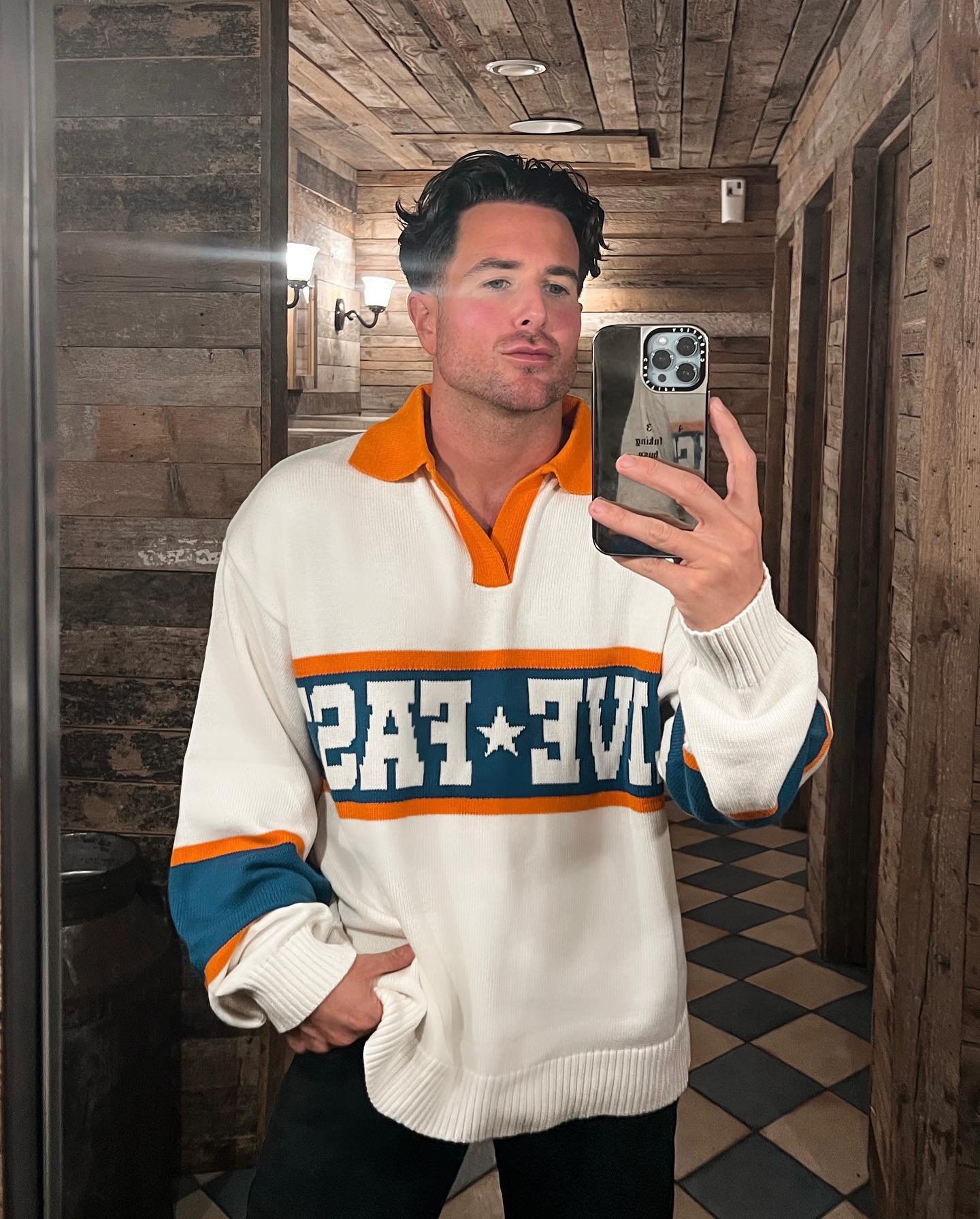 S Club Juniors star Aaron Renfree taking a selfie in a mirror and wearing an oversized jumper