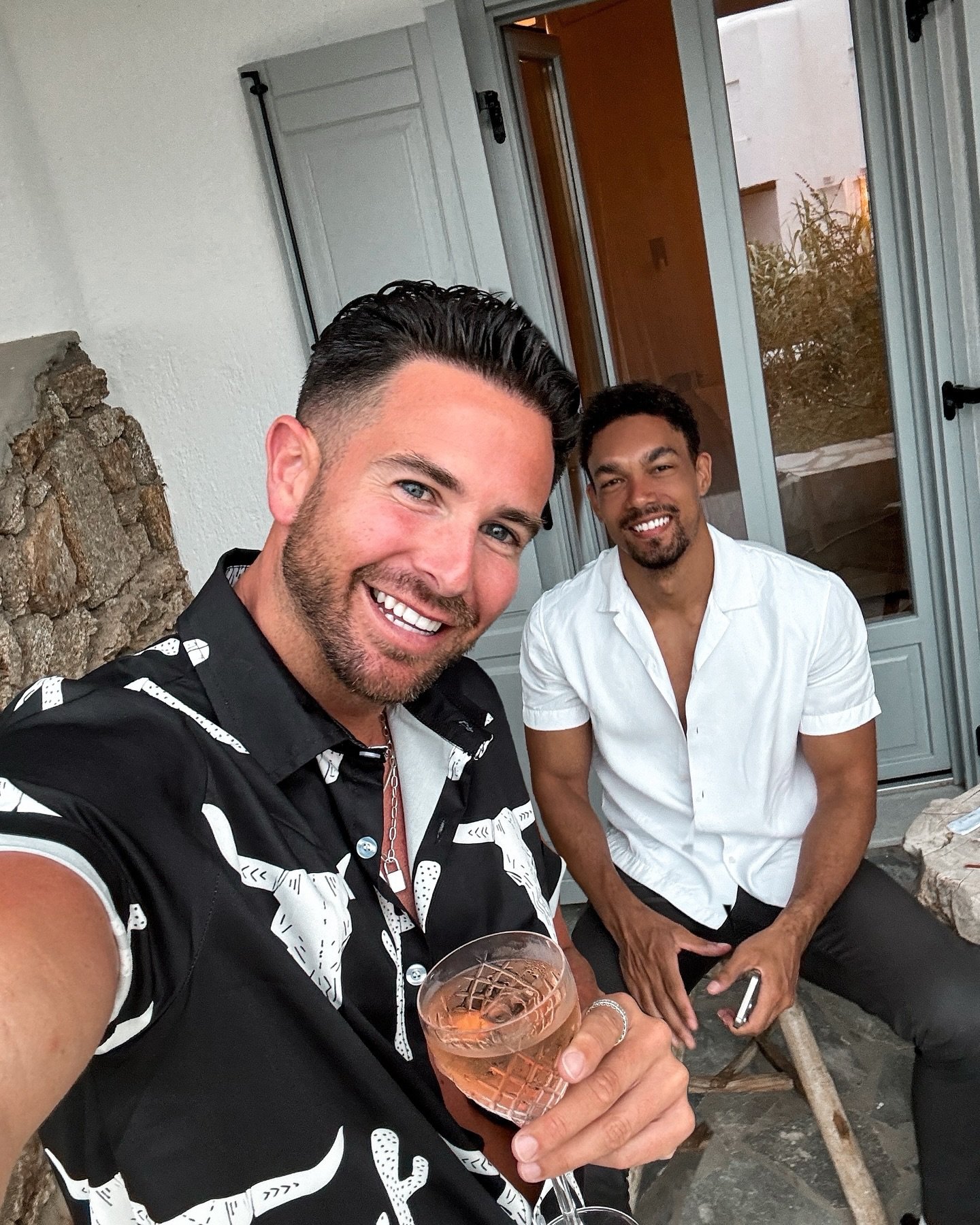 S Club Juniors star Aaron Renfree holding a glass of rose with a friend