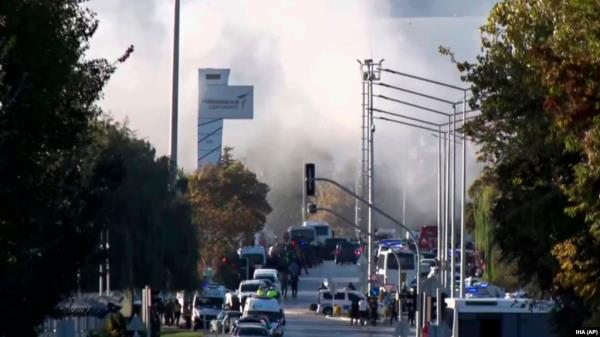 Smoke raises as emergency rescue teams and police officers attend outside Turkish Aerospace Industries Inc. on the outskirts of Ankara, Turkey, Oct. 23, 2024. 