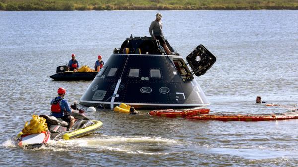 Orion module being recovered from sea