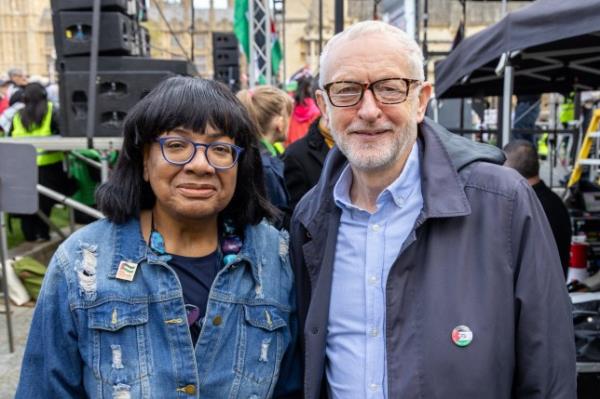 Diane Abbott and Jeremy Corbyn smile in a photo at a protest 