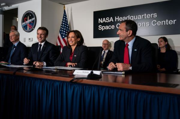 Vice President Kamala Harris is flanked by French President Emmanuel Macron and National Security Advisor Phil Gordon attend a meeting on French-US cooperation in Space, at NASA Headquarters on Wednesday, Nov. 30, 2022.