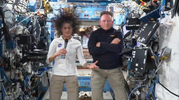 In this still image taken from a NASA TV broadcast, NASA astronauts Butch Wilmore (R) and Suni Williams hold a news conference from the International Space Station (ISS) on September 13, 2024.