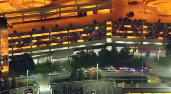 The shooting broke out inside a parking garage at the Philadelphia International Airport just after 11 p.m. as the officers were beginning their shift with the department's Airport Unit, police officials said.