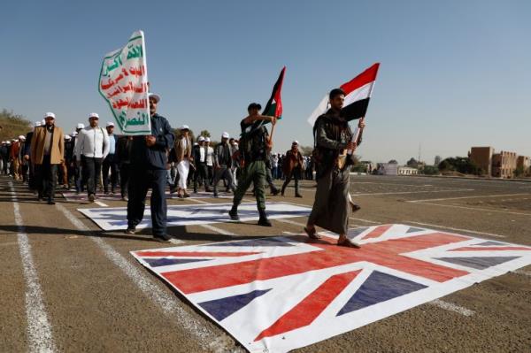 Newly recruited Houthi fighters attend a protest march against the U.S.-led strikes on Yemen and the Israeli war in the Gaza Strip, Wednesday, Feb. 21, 2024, in Sanaa, Yemen. (AP Photo/Osamah Abdulrahman)