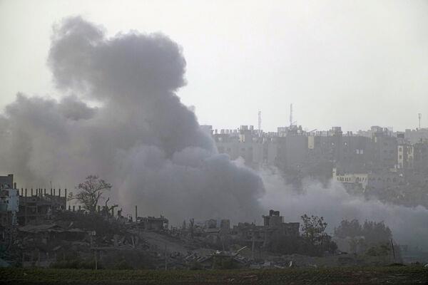 Smoke from shelling rises above the Gaza Strip, as seen from southern Israel, Thursday Nov. 9, 2023. (AP Photo/Leo Correa)