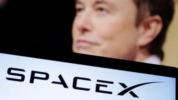 SpaceX logo and Elon Musk photo are seen in this illustration taken, December 19, 2022. Photo: REUTERS/Dado Ruvic/Illustration/File Photo