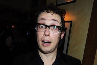 Balamory voice actor Bob Golding wearing thick rimmed glasses at a press night for a play