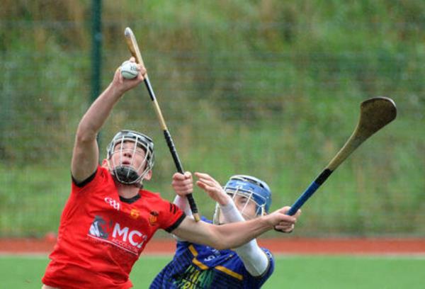 Christian Brothers College's Jake Brosnan winning the ball from Scoil Na Trionóide Naofa, Doon's Donnacha Hogan in the Dr. Harty Cup at Banteer. Picture Denis Minihane. Christian Brothers College's Jake Brosnan winning the ball from Scoil Na Trionóide Naofa, Doon's Donnacha Hogan in the Dr. Harty Cup at Banteer. Picture Denis Minihane.