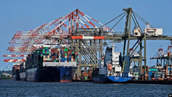 FILE - Container ships are docked at the Port of New York and New Jersey in Elizabeth, N.J., May 20, 2021.